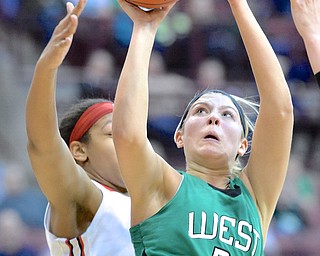 Jeff Lange | The Vindicator  West Branch's Pavin Heath (21) looks to the basket as she attempts a layup in the second quarter of the Lady Warriors' state semifinal game against Toledo Rogers, Friday night at OSU.