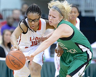 Jeff Lange | The Vindicator  Lady Warriors' Melinda Trimmer (right) knocks the ball away from Toledo's Shekinah Person in the third quarter of their state semifinal game, Friday night in Columbus.