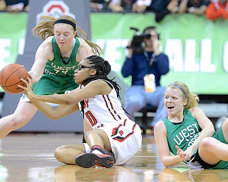 Jeff Lange | The Vindicator  Toledo's Shekinah Person (left) gets a pass off in front of the defense of two West Branch defenders Lea Bock (back) and Melinda Trimmer (right) in the fourth period of their DII state semifinal game, Friday night at the Schott in Columbus.