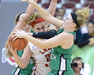 Jeff Lange | The Vindicator  Toledo's Sydney Petty struggles to maintain posession of the ball as she finds herself under heavy pressure put on by West Branch's Lea Bock (left) and Erica Johnson (right) in the final moments of their Division II state semifinal game, Friday night at OSU.