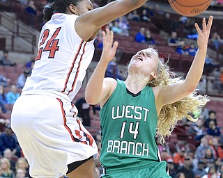 Jeff Lange | The Vindicator  Lady Warriors' Melinda Trimmer (14) has her layup smacked down by Toledo Rogers' Breylnn Hampton-Bey (24) in the second half of their DII state semifinal matchup in Columbus, Friday night.