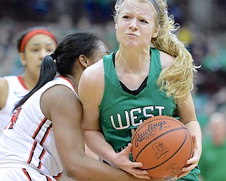 Jeff Lange | The Vindicator  Melinda Trimmer of West Branch (right) strains herself while going to the basket against Toledo Rogers' Breylnn Hampton-Bey in the second quarter of their Division II state semifinal game, Friday night at OSU.