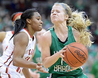 Jeff Lange | The Vindicator  Melinda Trimmer of West Branch strains herself while going to the basket against Toledo Rogers' Breylnn Hampton-Bey in the second quarter of their Division II state semifinal game, Friday night at OSU.