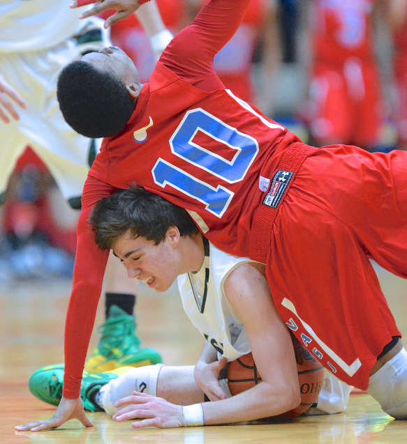Jeff Lange | The Vindicator  Greg Parella (bottom) is crushed by VASJ's Vaughn Johnson (top) as they battle for the ball during third quarter action of their regional championship game held at the Canton Fieldhouse, Saturday night.