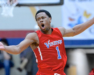 Jeff Lange | The Vindicator  Villa Angele-St.Joseph's Brian Parker celebrates after a third quarter slam dunk over Ursuline, Saturday night in Canton.
