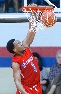 Jeff Lange | The Vindicator  Villa Angela-St.Joseph's Brian Parker (1) looks as he slams the ball through the hoop for two in the third quarter of the Vikings' regional championship game against Ursuline, Saturday night in Canton.