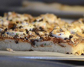Katie Rickman | The Vindicator.Many variations of pizza was available at the Mahoning Valley Pizza Cook-Off benefit for Potential Development Schools at Mr. Anthony's in Boardman on Sunday, March 8, 2015. Featured here is a cannoli pizza from Bruno Bros.