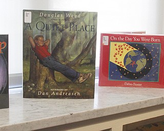        ROBERT K. YOSAY  | THE VINDICATOR..Carla Hlavac is director of Diocese of Youngstown Library and Media Center. She takes pop up library to various events. the library is not just for Catholics. It has a wide range of spiritual books,. ..