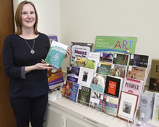        ROBERT K. YOSAY  | THE VINDICATOR..Carla Hlavac is director of Diocese of Youngstown Library and Media Center. She takes pop up library to various events. the library is not just for Catholics. It has a wide range of spiritual books,. ..