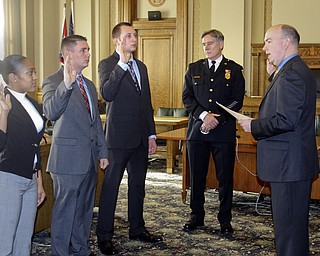        ROBERT K. YOSAY  | THE VINDICATOR.. With Chief Robin Lees in the backround -  Mayor John A McNally --  talks about the new officers ..Sworn in was Jeshalia Dunkle, 22, of Youngstown; Travis Sheely, 24, of Mineral Ridge; and Michael Conway, 24, of Niles.