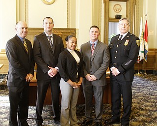        ROBERT K. YOSAY  | THE VINDICATOR..  Mayor John A McNally --  talks about the new officers ..Sworn in was Michael Conway, 24, of Niles. Jeshalia Dunkle, 22, of Youngstown; Travis Sheely, 24, of Mineral Ridge; . With Chief Robin Lees