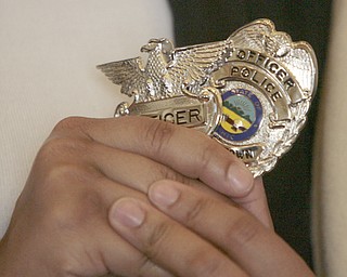        ROBERT K. YOSAY  | THE VINDICATOR.. With Chief Robin Lees in the backround -  Mayor John A McNally --  talks about the new officers ..Sworn in was Jeshalia Dunkle, 22, of Youngstown; Travis Sheely, 24, of Mineral Ridge; and Michael Conway, 24, of Niles.