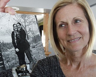 William D. Lewis the Vindicator Pam Politsky, mother of Kelly McCracken who is involved in same sex marriage case that US Supreme court will hear, holds a photo of her daughter Kelly McCracken, right, and wife .