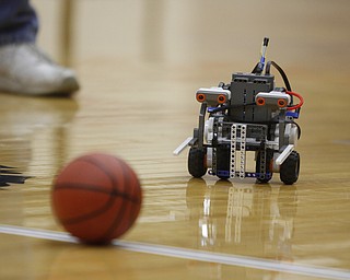        ROBERT K. YOSAY  | THE VINDICATOR..A Robot moves towards the ball in the 'FastBreak' part of the  competition..The 18th annual Northeast Ohio Robotics Education Program Competition took place at Beeghly Center at YSU.Eighteen teams from 11 schools from Mahoning, Trumbull counties competed,..