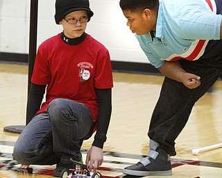       ROBERT K. YOSAY  | THE VINDICATOR..James Barginer and JosephCarbon both 8th graders - talk over strategy before the start of the  'Windsprint'.. The 18th annual Northeast Ohio Robotics Education Program Competition took place at Beeghly Center at YSU.Eighteen teams from 11 schools from Mahoning, Trumbull counties competed,..
