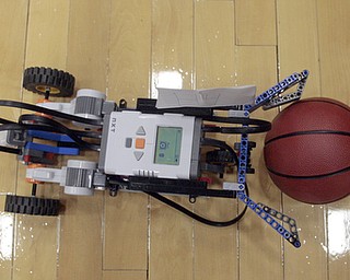        ROBERT K. YOSAY  | THE VINDICATOR..The robot grabs the ball and heads to the other side of the gym as part of the competition... The 18th annual Northeast Ohio Robotics Education Program Competition took place at Beeghly Center at YSU.Eighteen teams from 11 schools from Mahoning, Trumbull counties competed,..