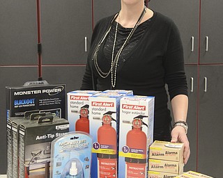 Katie Rickman | The Vindicator.Yvonne Wilson stands behinds some of the donated safety products that will be given away at the Struthers Safety Fair March 23.