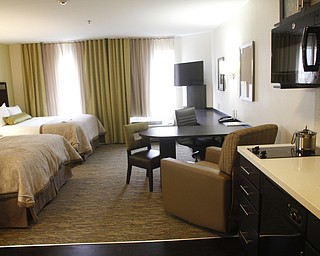        ROBERT K. YOSAY  | THE VINDICATOR..This is a typical room with work area ..  kitchen area with stove, dishwasher, refrigerator..Candlewood Suites has been in operation for 6 months and held its ribbon cutting ceremony wed morning....
