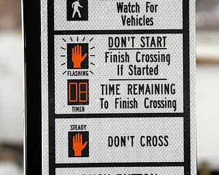        ROBERT K. YOSAY  | THE VINDICATOR..A new traffic system is being set up in Canfield as Cornerstone Electric in Salem installs the lights w traffic sensors and also sensors for emergency vehicles that will trip the lights to red, the city also gets new cross walk signs.  Adam Blackwood with Cornerstone installs a new light at Main and Broad in Canfield