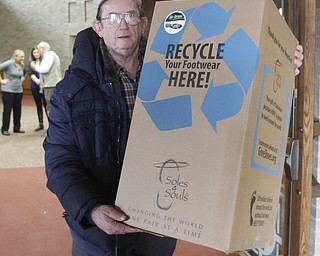        ROBERT K. YOSAY  | THE VINDICATOR..Soul 4 Souls at St Charles Church in Boardman collects shoes and distributes them to people in need of shoes..