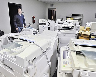 Jeff Lange | The Vindicator  Dave Nestic of TBEIC looks on at a sea of old copy machines found in a second floor office of the old administration building of the RG Steel Plant, Wednesday, March 11, 2015.