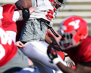 YOUNGSTOWN, OHIO - MARCH 24, 2015: Avery Moss #9 of YSU gets inside of a block and into the backfield during Tuesday afternoons practice at Stambaugh Stadium. (Photo by David Dermer/Youngstown Vindicator)
