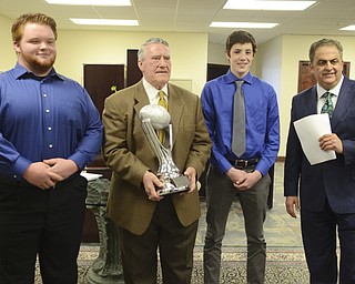 Katie Rickman | The Vindicator.Jackson-Milton's Tyler Phillips (left) and Hubbard's Colin Burdette (right) pose for a photo with John Kopp and David Betras (far right) who presented each high school student with the Heart of a Champion Award.