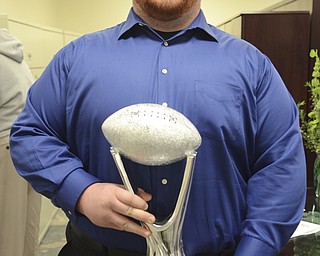 Katie Rickman | The Vindicator.Tyler Philips of Jackson-Milton holds the Heart of a Champion Award on March 12, 2015.