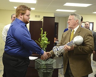Katie Rickman | The Vindicator.John Kopp presents Tyler Philips of Jackson-Milton the Heart of a Champion Award on March 12, 2015.