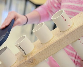 Katie Rickman | The Vindicator.Kori Edwards a senior at Jackson-Milton plays a PVC pipe musical instrument that she and classmates made for a physics competition.