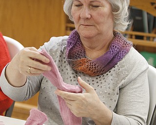        ROBERT K. YOSAY  | THE VINDICATOR..TheyÕre a closeknit group in more ways than one..The Thursday knitters at Grace United Methodist Church, Warren meet weekly, weather permitting, from 10 a.m. into mid-afternoon.a.