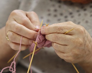        ROBERT K. YOSAY  | THE VINDICATOR..TheyÕre a closeknit group in more ways than one..The Thursday knitters at Grace United Methodist Church, Warren meet weekly, weather permitting, from 10 a.m. into mid-afternoon.a.