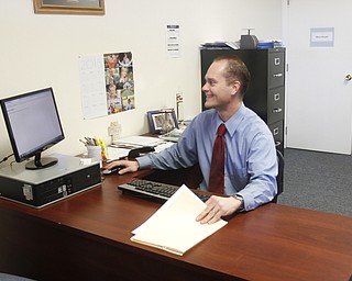        ROBERT K. YOSAY  | THE VINDICATOR..Tax 29/ Andrew Reigstad is busy as the tax season hits the home stretch- in his poland office on 224