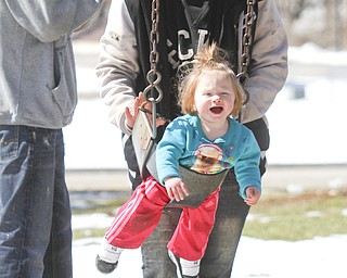        ROBERT K. YOSAY  | THE VINDICATOR..Sunny and sunny and did i hear its SUNNY out as temperatures hit the 50's  people are breaking out of hibernation -  At Packard Park in Warren Aubrey May Newton 14 months takes some time on the swing with her mom Christina  .. she spent the afternoon with her mom and dad of Warren Corey and Christina