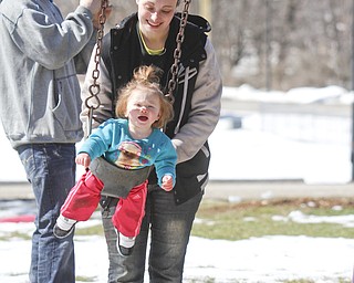        ROBERT K. YOSAY  | THE VINDICATOR..Sunny and sunny and did i hear its SUNNY out as temperatures hit the 50's  people are breaking out of hibernation -  At Packard Park in Warren Aubrey May Newton 14 months takes some time on the swing with her mom Christina  .. she spent the afternoon with her mom and dad of Warren Corey and Christina