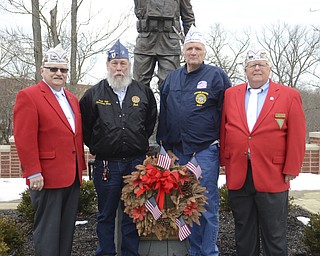 Katie Rickman | The Vindicator.Veterans L-R Jack Ranck of Warren, Bud Luman of Bristol, DeWayne Wells of Cortland and Bill Conrad stand in front of the WWI doughboy statue at Veterans Memorial Park in Warren on March 13, 2015.