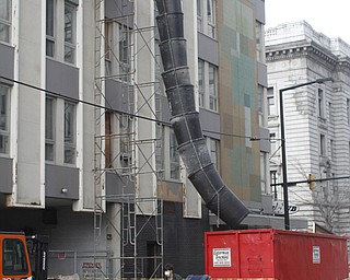        ROBERT K. YOSAY  | THE VINDICATOR..The Legal Arts Building - and The Hub Restaurant  on Market and Boardman felt the ravages of winter as a roof drain pipe froze sending water throughout the building.