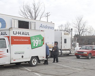       ROBERT K. YOSAY  | THE VINDICATOR..Troops used private cars, rented trucks, pickups .. and whatever they could find to load the  boxes of cookies from the semis to their home..Girl Scout cookies by the thousands of boxes, arrived via 4 semi-trucks Friday  at W. D. Packard Music Hall here and are arriving sat at St. Michael Parish in Canfield to be picked up by local Girl Scout leaders for distribution to their troop members.