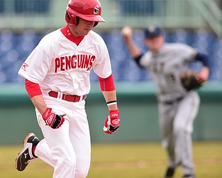 NILES, OHIO - MARCH 25, 2015: Kevin Hix #1 of YSU runs to first base while pitcher Sam Mersing #19 of Pitt throws to first for the out in the bottom of the 3rd inning during Wednesday afternoons game at Eastwood Field. (Photo by David Dermer/Youngstown Vindicator)