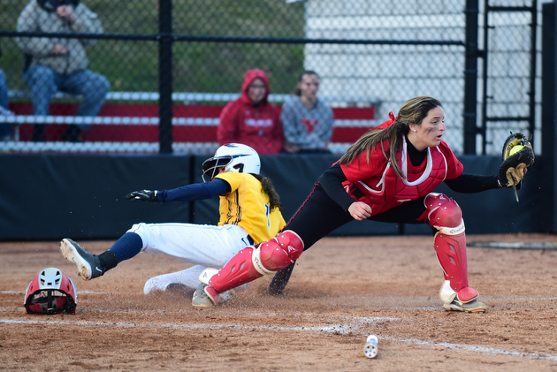 YOUNGSTOWN, OHIO - MARCH 25, 2015: Catcher Maria Lacatena #15 of YSU keeps her foot on the bag to force out base runner Dani Ramos #1 of Kent State for the 1st out in the top of the 3rd inning during game 2 of a doubleheader Wednesday night at the YSU Softball Complex. (Photo by David Dermer/Youngstown Vindicator)