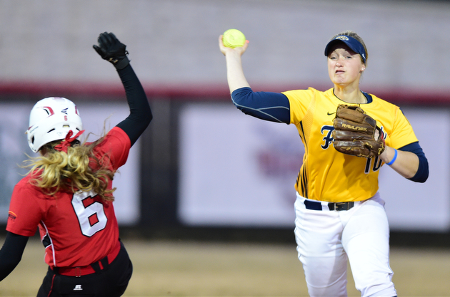 YOUNGSTOWN, OHIO - MARCH 25, 2015: Shortstop Holly Speers #10 of Kent State throws the ball to first base to turn a double play after forcing out Stevie Taylor #6 of YSU to end the bottom of the 4th inning during game 2 of a doubleheader Wednesday night at the YSU Softball Complex. (Photo by David Dermer/Youngstown Vindicator)