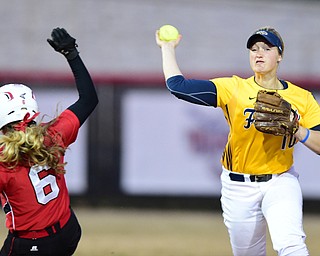 YOUNGSTOWN, OHIO - MARCH 25, 2015: Shortstop Holly Speers #10 of Kent State throws the ball to first base to turn a double play after forcing out Stevie Taylor #6 of YSU to end the bottom of the 4th inning during game 2 of a doubleheader Wednesday night at the YSU Softball Complex. (Photo by David Dermer/Youngstown Vindicator)