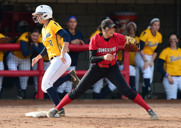 YOUNGSTOWN, OHIO - MARCH 25, 2015: First basemen Miranda Castiglione #17 of YSU keeps her foot on the bag to force out Shelbi Tilton #12 of Kent State for the 3rd out in the top of the 3rd inning during game 1 of a doubleheader Wednesday night at the YSU Softball Complex. (Photo by David Dermer/Youngstown Vindicator)