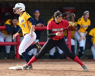 YOUNGSTOWN, OHIO - MARCH 25, 2015: First basemen Miranda Castiglione #17 of YSU keeps her foot on the bag to force out Shelbi Tilton #12 of Kent State for the 3rd out in the top of the 3rd inning during game 1 of a doubleheader Wednesday night at the YSU Softball Complex. (Photo by David Dermer/Youngstown Vindicator)
