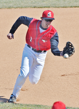 Jeff Lange | The Vindicator  YSU second baseman Kevin Hix fields a ground ball during first inning action against the UIC Flames in game one of their double header at Eastwood Field in Niles, Sunday, March 29, 2015.