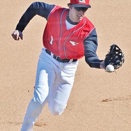 Jeff Lange | The Vindicator  YSU second baseman Kevin Hix fields a ground ball during first inning action against the UIC Flames in game one of their double header at Eastwood Field in Niles, Sunday, March 29, 2015.