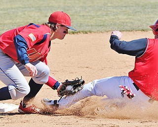 Jeff Lange | The Vindicator  YSU baserunner Kevin Hix (1) is tagged out at second by UIC's David Cronin in the bottom of the second inning of their first game in Niles, Sunday, March 29, 2015.
