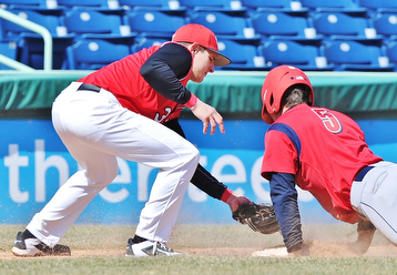 Jeff Lange | The Vindicator  YSU third baseman Josh Fitch (left) attempts to put the tag on UIC baserunner Tyler Detmer (5) as he slides safely into third base in the fourth inning of their first game in Niles, Sunday, March 29, 2015.