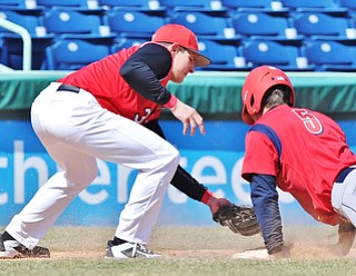 Jeff Lange | The Vindicator  YSU third baseman Josh Fitch (left) attempts to put the tag on UIC baserunner Tyler Detmer (5) as he slides safely into third base in the fourth inning of their first game in Niles, Sunday, March 29, 2015.