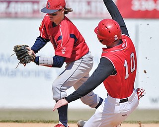 Jeff Lange | The Vindicator  YSU's Alex Core (10) slides into second base as UIC second baseman David Cronin steps on the bag for the out in the bottom of the fifth inning of their game at Eastwood Field, Sunday, March 29, 2015.